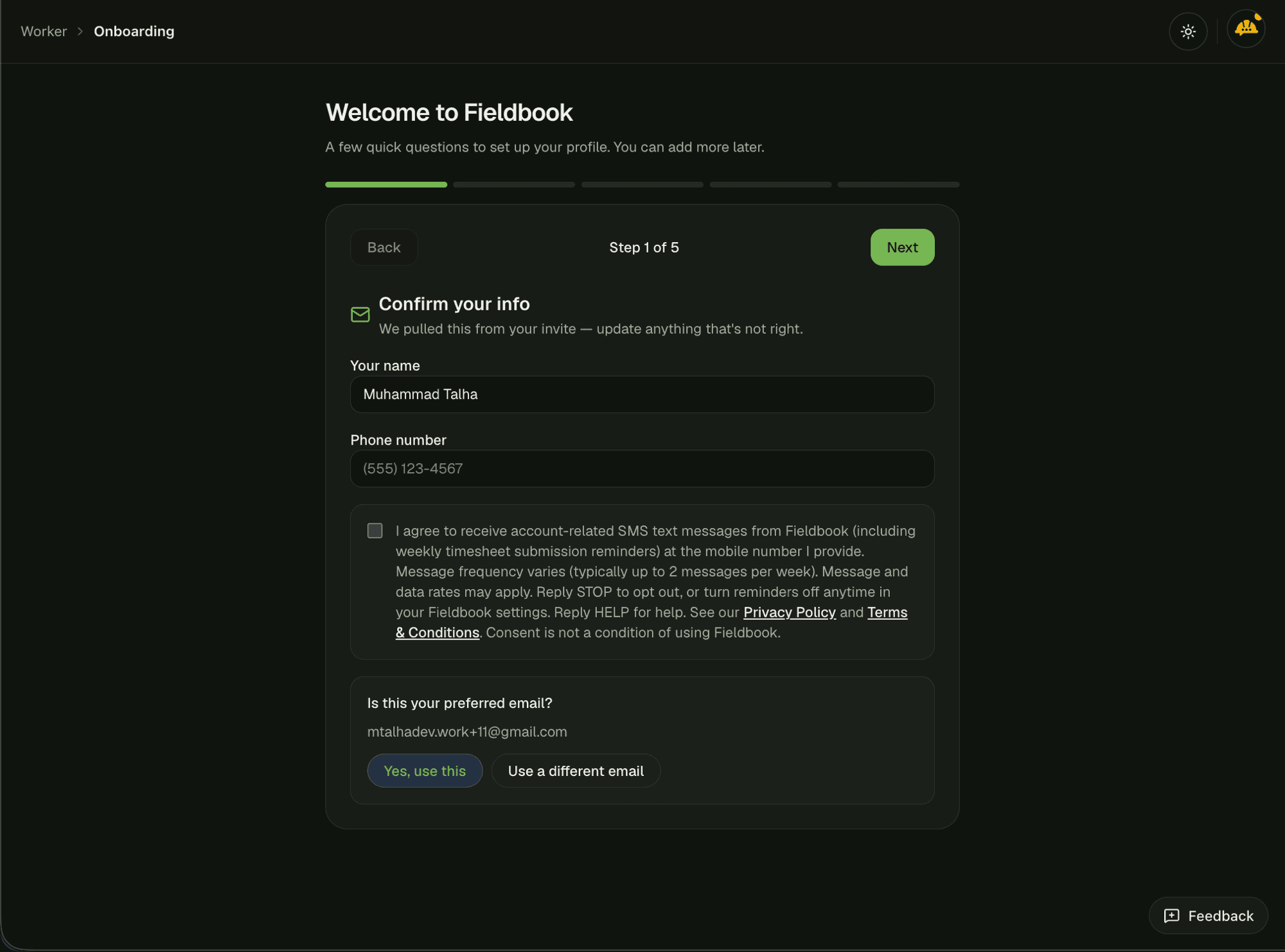 Fieldbook worker onboarding Confirm your info step showing the phone number field and an unchecked SMS consent checkbox with full disclosure text